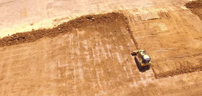 bulldozer pushing dirt